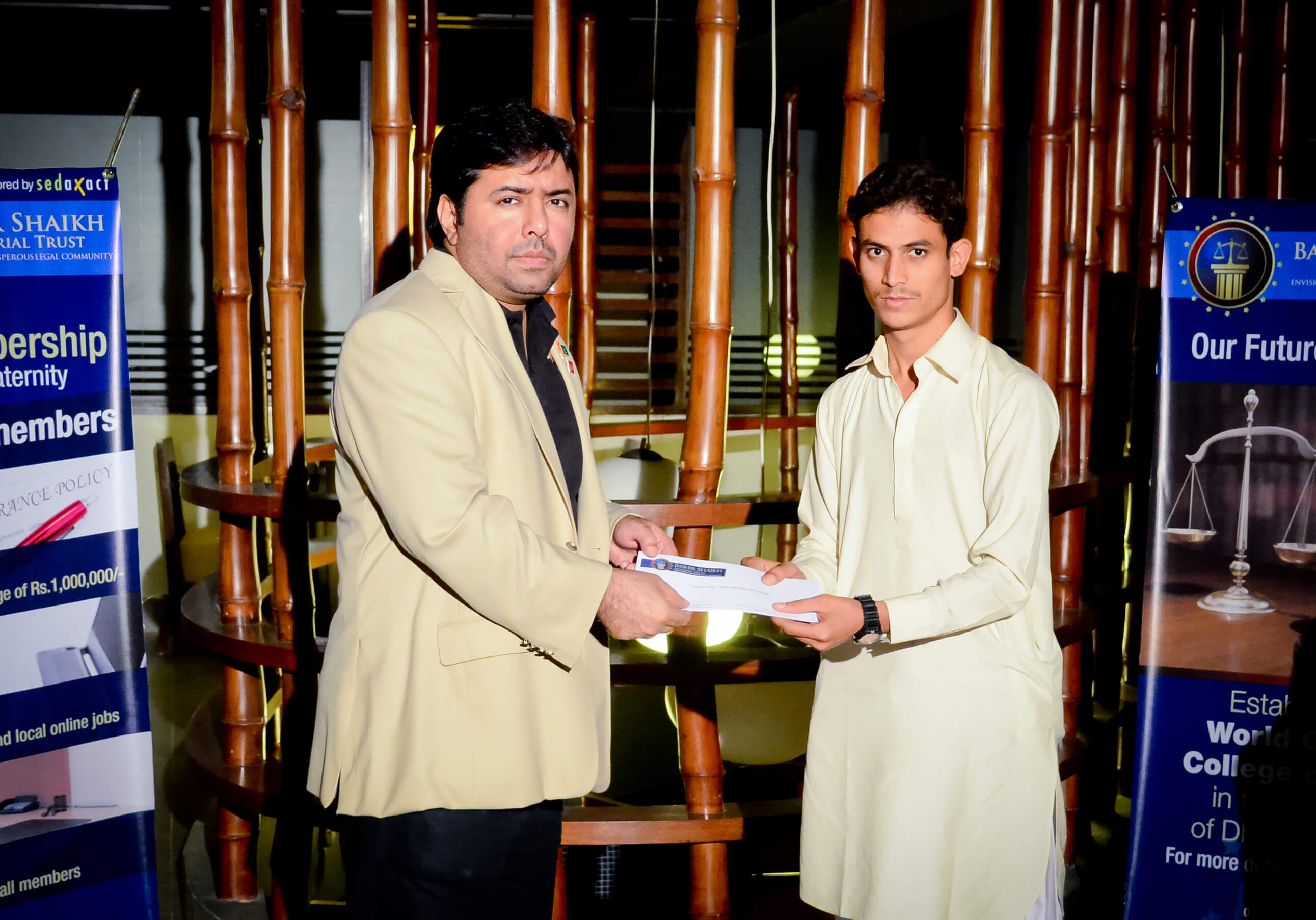 Mr.Shoaib Ahmed Shaikh, Chairman, BSMT, presenting a cheque to the family member of the deceased member.