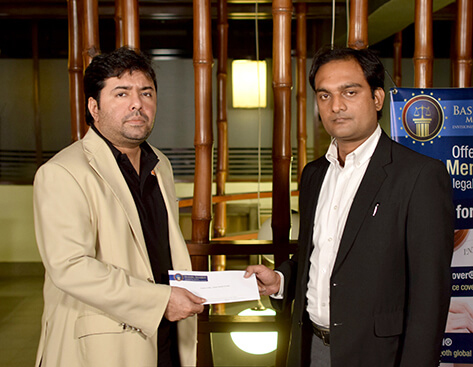 Mr.Shoaib Ahmed Shaikh, Chairman, BSMT presenting a cheque to the family of the deceased member