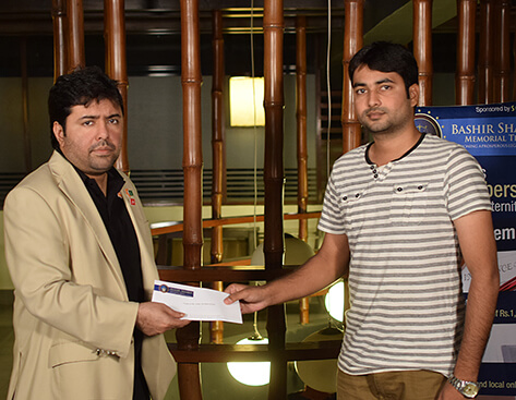 Mr.Shoaib Ahmed Shaikh, Chairman, BSMT presenting a cheque to the family of the deceased member
